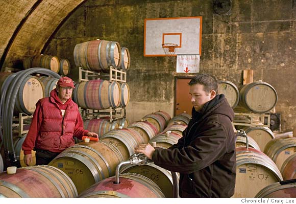 Photo of Doug (left) and Andrew (right) Nalle of Nalle Winery. Doug's son, Andrew is the winemaker. They are filling wine barrels in their winery. The basketball hoop in the background was for Andrew and his brother while growing up as kids. Andrew still shoots hoops once in a while. His brother is now going to college in Chicago. They are in the Dry Creek Valley area. on 1/8/08 in Healdsburg. photo by Craig Lee / The Chronicle